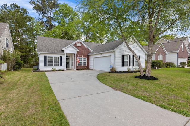 view of front of house featuring a garage, driveway, a front yard, and a shingled roof
