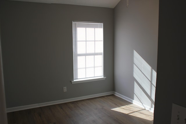 unfurnished room with wood-type flooring