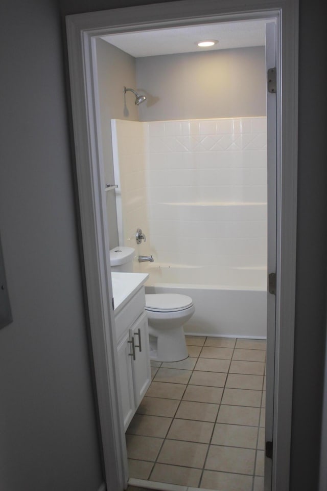 full bathroom with tub / shower combination, tile patterned flooring, vanity, and toilet