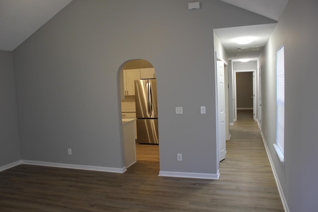 interior space featuring lofted ceiling and wood-type flooring