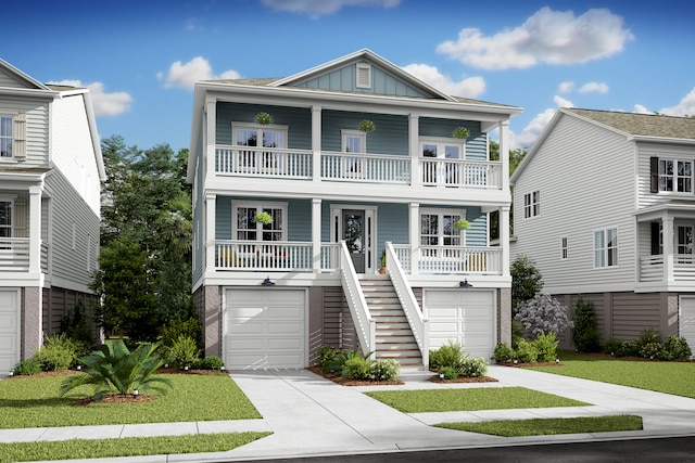 coastal inspired home with stairway, covered porch, board and batten siding, and driveway