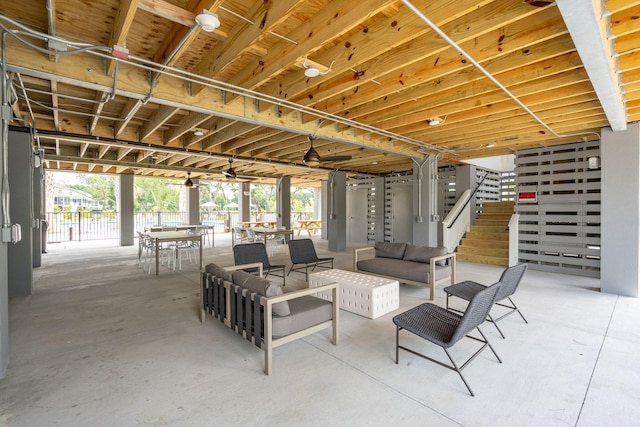 view of patio featuring stairway, outdoor dining space, and an outdoor hangout area