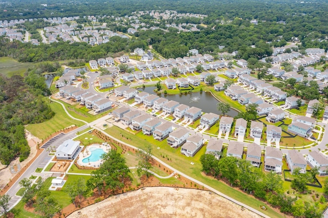 drone / aerial view featuring a residential view and a water view