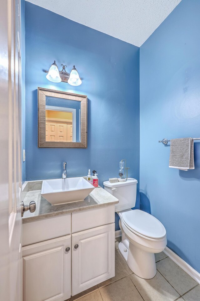 1972 Gray Battery Ct, Mount Pleasant, SC 29464 - half bathroom featuring tile patterned floors, vanity, and a textured ceiling