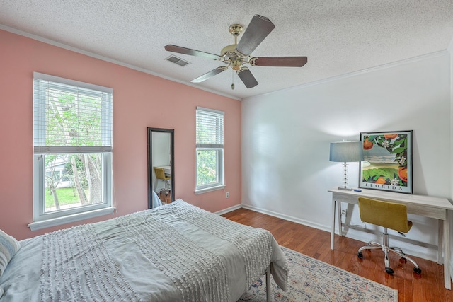 1972 Gray Battery Ct, Mount Pleasant, SC 29464 - bedroom featuring ornamental molding, multiple windows, a textured ceiling, wood finished floors, and an office area
