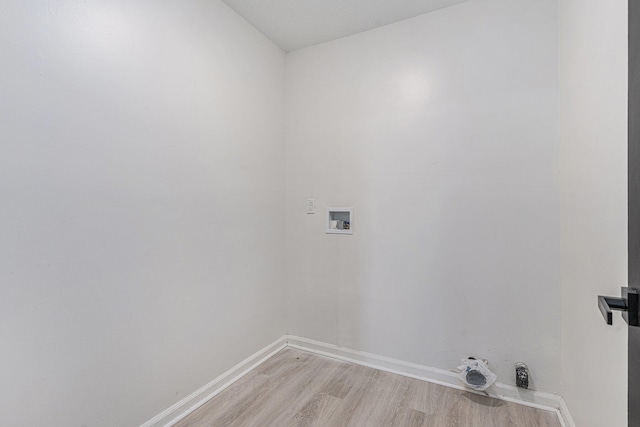 laundry room with gas dryer hookup, light wood-type flooring, and hookup for a washing machine