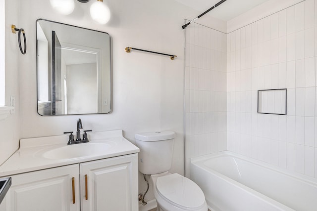 full bathroom featuring vanity, toilet, and tiled shower / bath