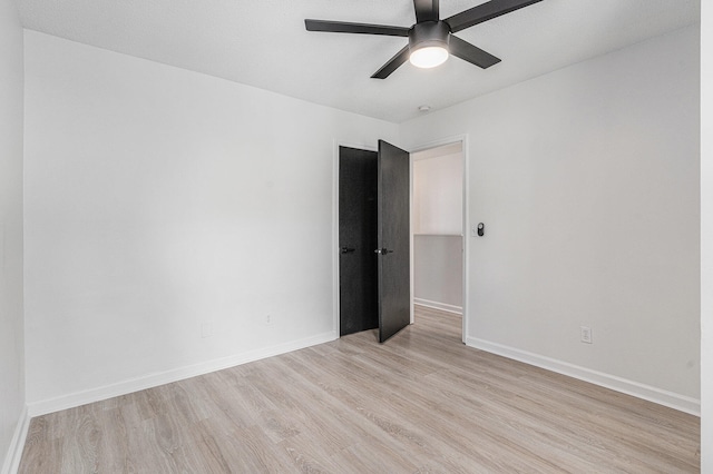 unfurnished room with light hardwood / wood-style floors and ceiling fan