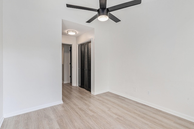 unfurnished room featuring light wood-type flooring and ceiling fan