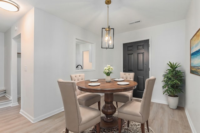 dining area with light wood-type flooring