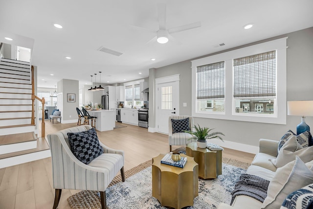 101 Hanover St, Charleston, SC 29403 - living room with light wood-style floors, stairway, a ceiling fan, and recessed lighting