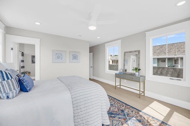 101 Hanover St, Charleston, SC 29403 - bedroom with wood finished floors, multiple windows, ceiling fan, and recessed lighting