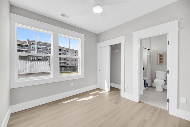 101 Hanover St, Charleston, SC 29403 - unfurnished bedroom featuring wood finished floors, a closet, connected bathroom, and a ceiling fan
