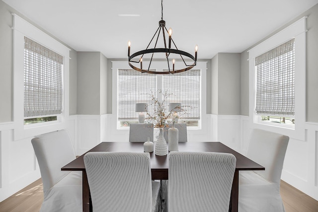 101 Hanover St, Charleston, SC 29403 - dining room featuring a chandelier, a wainscoted wall, wood finished floors, and a decorative wall
