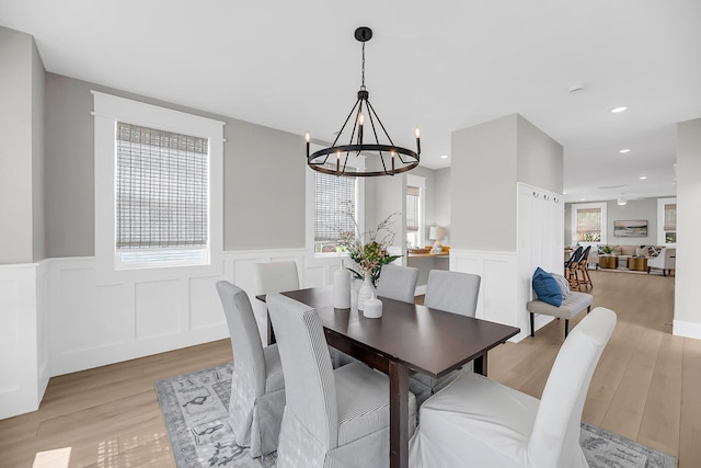 101 Hanover St, Charleston, SC 29403 - dining space featuring a chandelier, light wood-style floors, wainscoting, recessed lighting, and a decorative wall