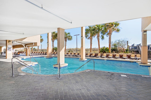 view of swimming pool featuring a patio