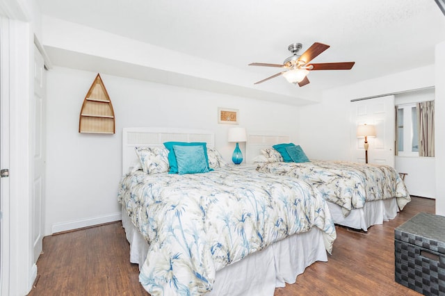 bedroom featuring dark hardwood / wood-style floors and ceiling fan