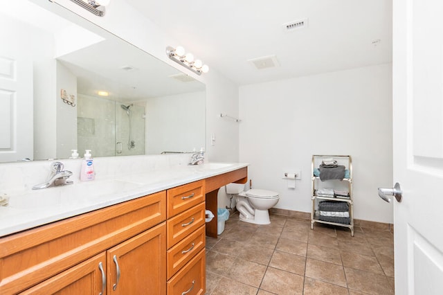 bathroom with tile patterned flooring, vanity, toilet, and walk in shower