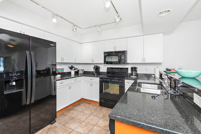 kitchen featuring rail lighting, sink, black appliances, light tile patterned floors, and white cabinets