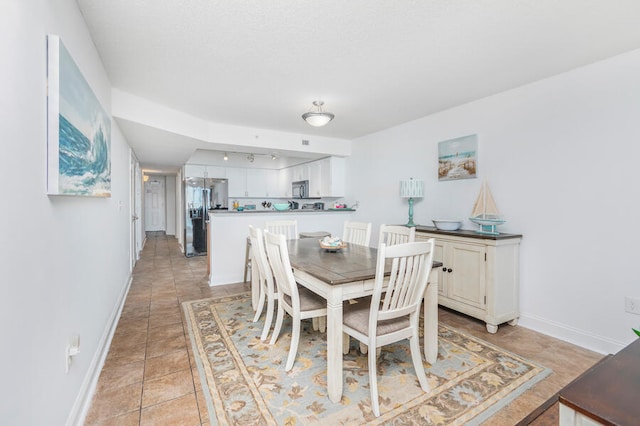 dining space with light tile patterned floors