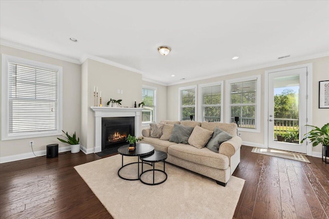 living area with a fireplace with flush hearth, dark wood-style floors, baseboards, ornamental molding, and recessed lighting
