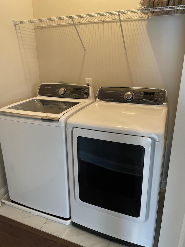laundry room with washer and clothes dryer