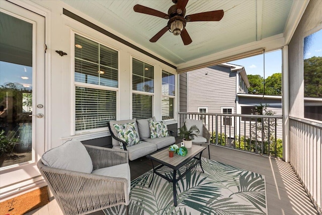 sunroom / solarium featuring a ceiling fan and an outdoor hangout area