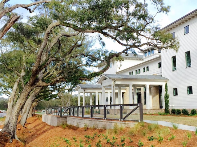 view of property exterior with covered porch