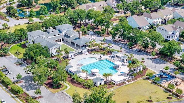 aerial perspective of suburban area featuring a pool
