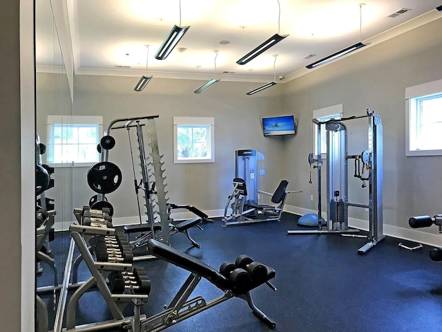 exercise room with plenty of natural light and baseboards