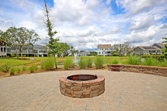 view of patio / terrace with a residential view and an outdoor fire pit