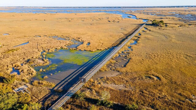 aerial view of property's location featuring a nearby body of water