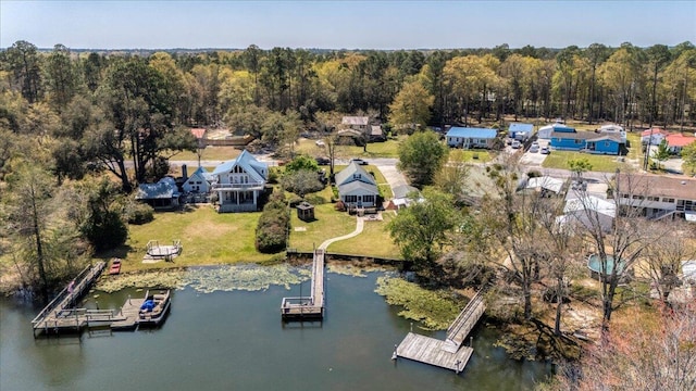 drone / aerial view with a view of trees and a water view