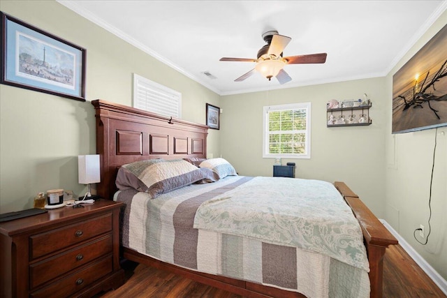 bedroom with ceiling fan, dark wood-style floors, visible vents, and ornamental molding
