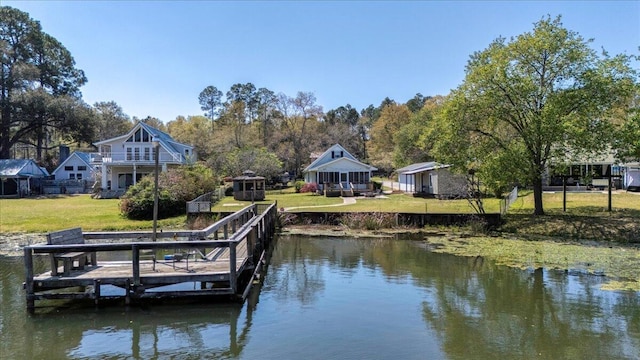 dock area featuring a yard and a water view