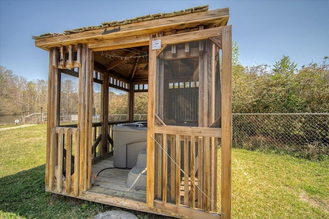 view of outbuilding featuring an outbuilding and fence