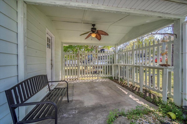 view of patio featuring a ceiling fan and fence