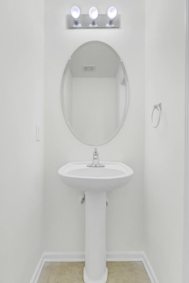 bathroom featuring baseboards