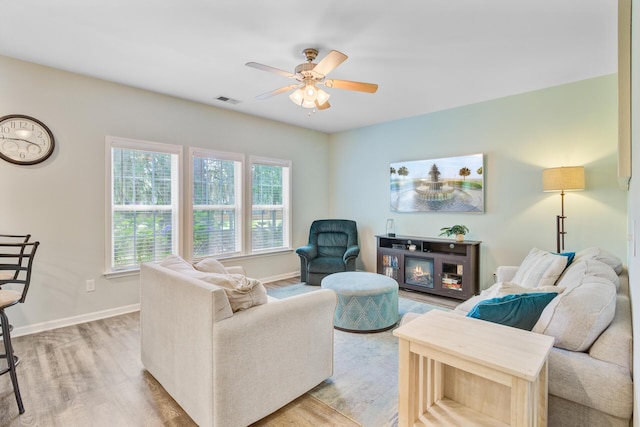 5433 Falling Tide, North Charleston, SC 29420 - living room with light wood-style floors, ceiling fan, and baseboards