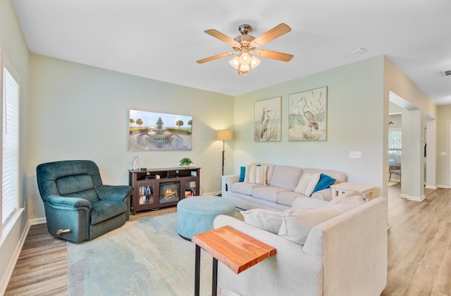 5433 Falling Tide, North Charleston, SC 29420 - living room featuring plenty of natural light, wood finished floors, and baseboards