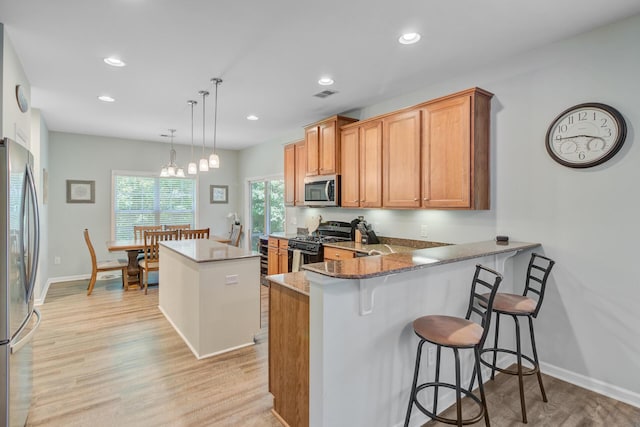 5433 Falling Tide, North Charleston, SC 29420 - kitchen featuring stainless steel appliances, light wood finished floors, a kitchen island, recessed lighting, and pendant lighting