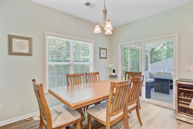 5433 Falling Tide, North Charleston, SC 29420 - dining area with beverage cooler, a chandelier, and light wood-type flooring