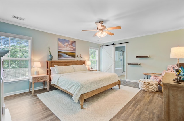 5433 Falling Tide, North Charleston, SC 29420 - bedroom with a barn door, baseboards, wood finished floors, crown molding, and a ceiling fan