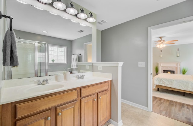 5433 Falling Tide, North Charleston, SC 29420 - ensuite bathroom featuring a shower stall, double vanity, tile patterned floors, baseboards, and a ceiling fan