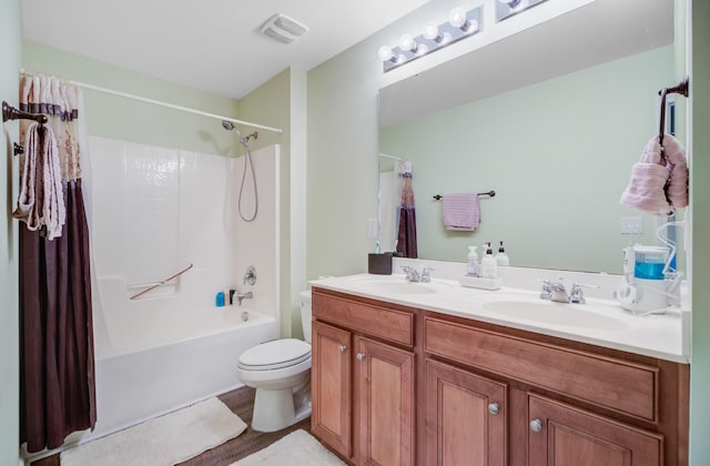 5433 Falling Tide, North Charleston, SC 29420 - full bathroom with double vanity, shower / tub combo with curtain, toilet, and wood finished floors