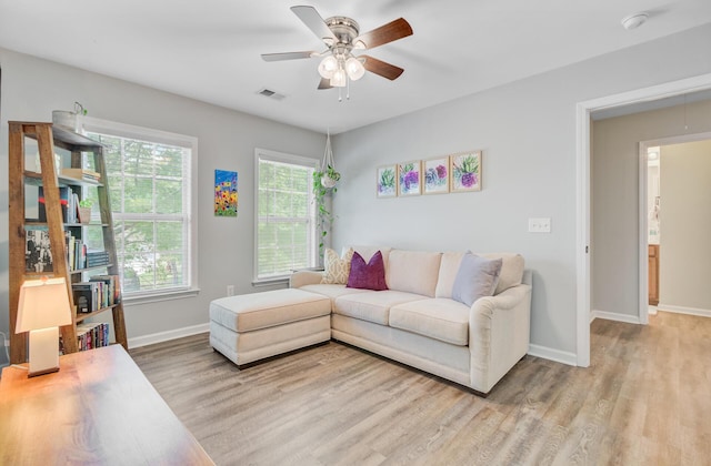 5433 Falling Tide, North Charleston, SC 29420 - living room with light wood-type flooring, a ceiling fan, and baseboards
