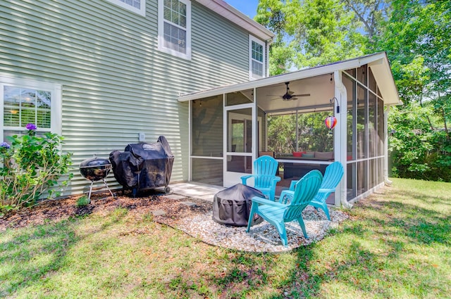 5433 Falling Tide, North Charleston, SC 29420 - rear view of property featuring a sunroom, ceiling fan, a fire pit, and a lawn