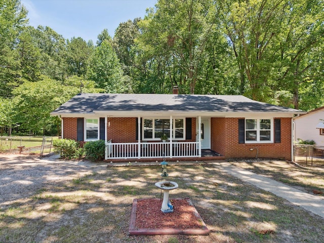 ranch-style home featuring covered porch