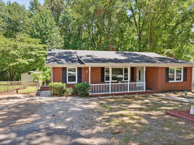 ranch-style house featuring covered porch