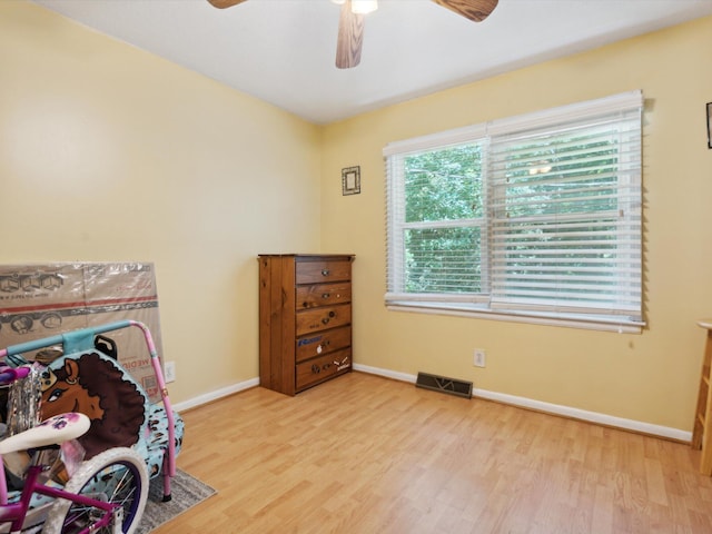 interior space with ceiling fan and light hardwood / wood-style floors